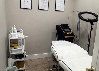 Aesthetic treatment room at VZKN, London, England, GB with equipment and cozy ambiance.