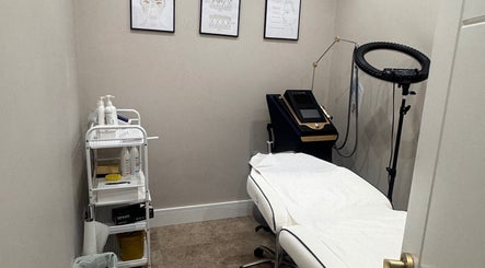 Aesthetic treatment room at VZKN, London, England, GB with equipment and cozy ambiance.