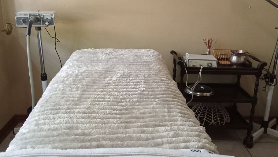 Massage bed and equipment at Queen R Spa in Johannesburg, Gauteng, ZA, offering a serene wellness experience.