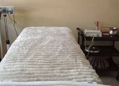 Massage bed and equipment at Queen R Spa in Johannesburg, Gauteng, ZA, offering a serene wellness experience.