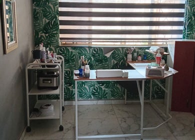 Beauty treatment station at Queen R Spa, Johannesburg, Gauteng, ZA, featuring tropical decor and modern tools.