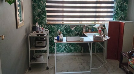 Beauty treatment station at Queen R Spa, Johannesburg, Gauteng, ZA, featuring tropical decor and modern tools.