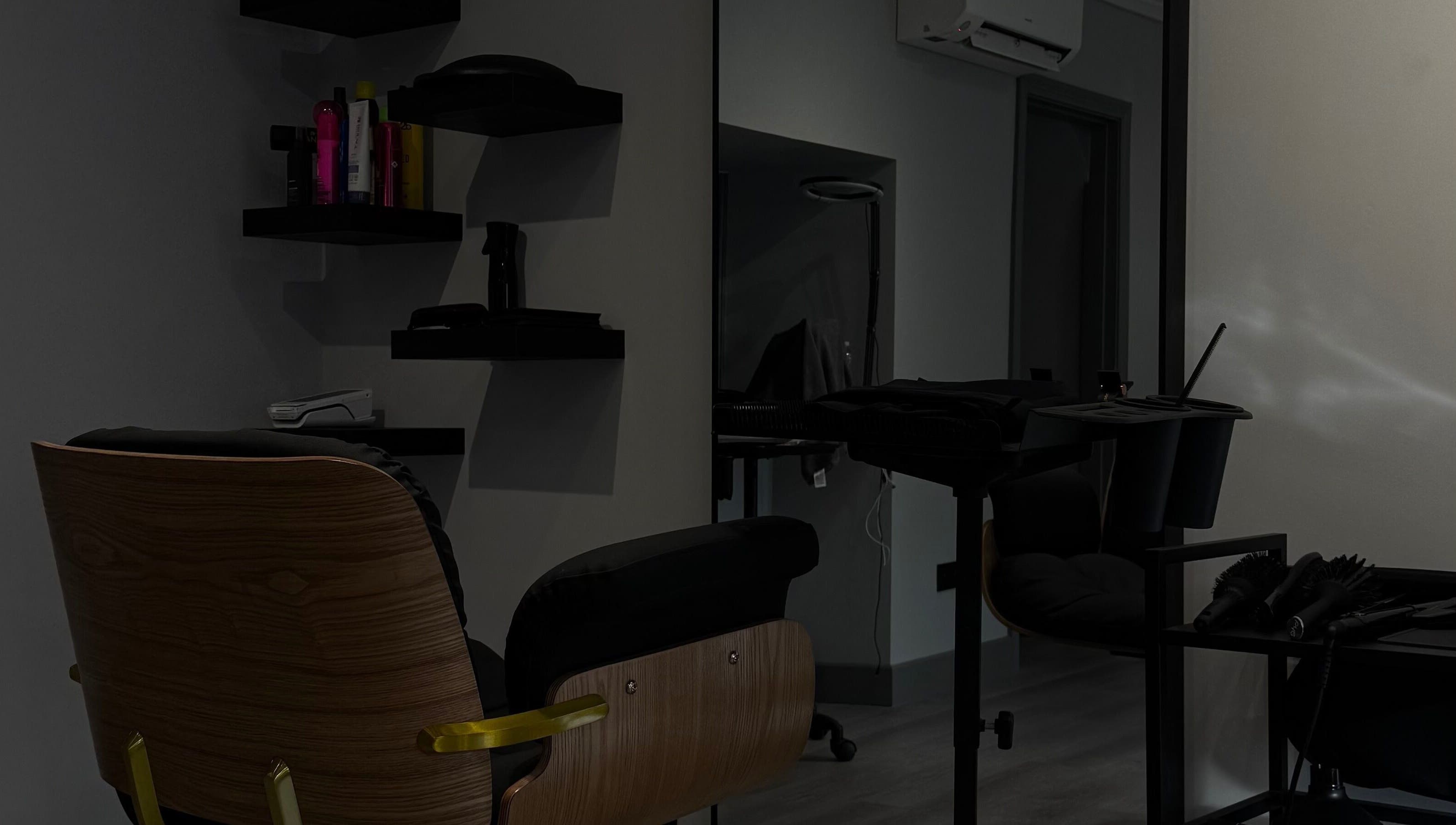 Modern hair salon setup at HAIR Extensions & Treatments, Ennis, County Clare, IE, featuring sleek chair and tools.