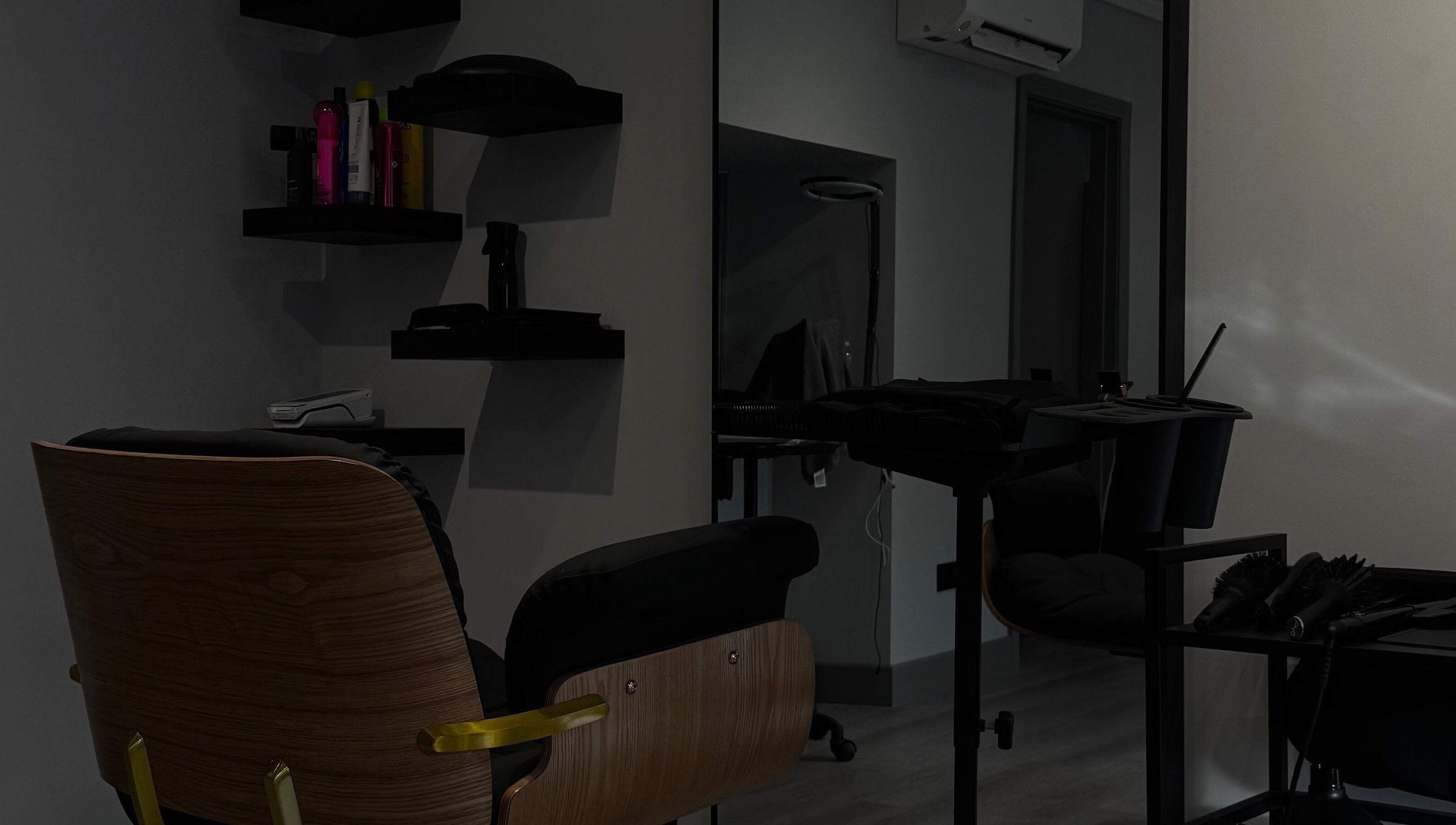 Modern hair salon setup at HAIR Extensions & Treatments, Ennis, County Clare, IE, featuring sleek chair and tools.