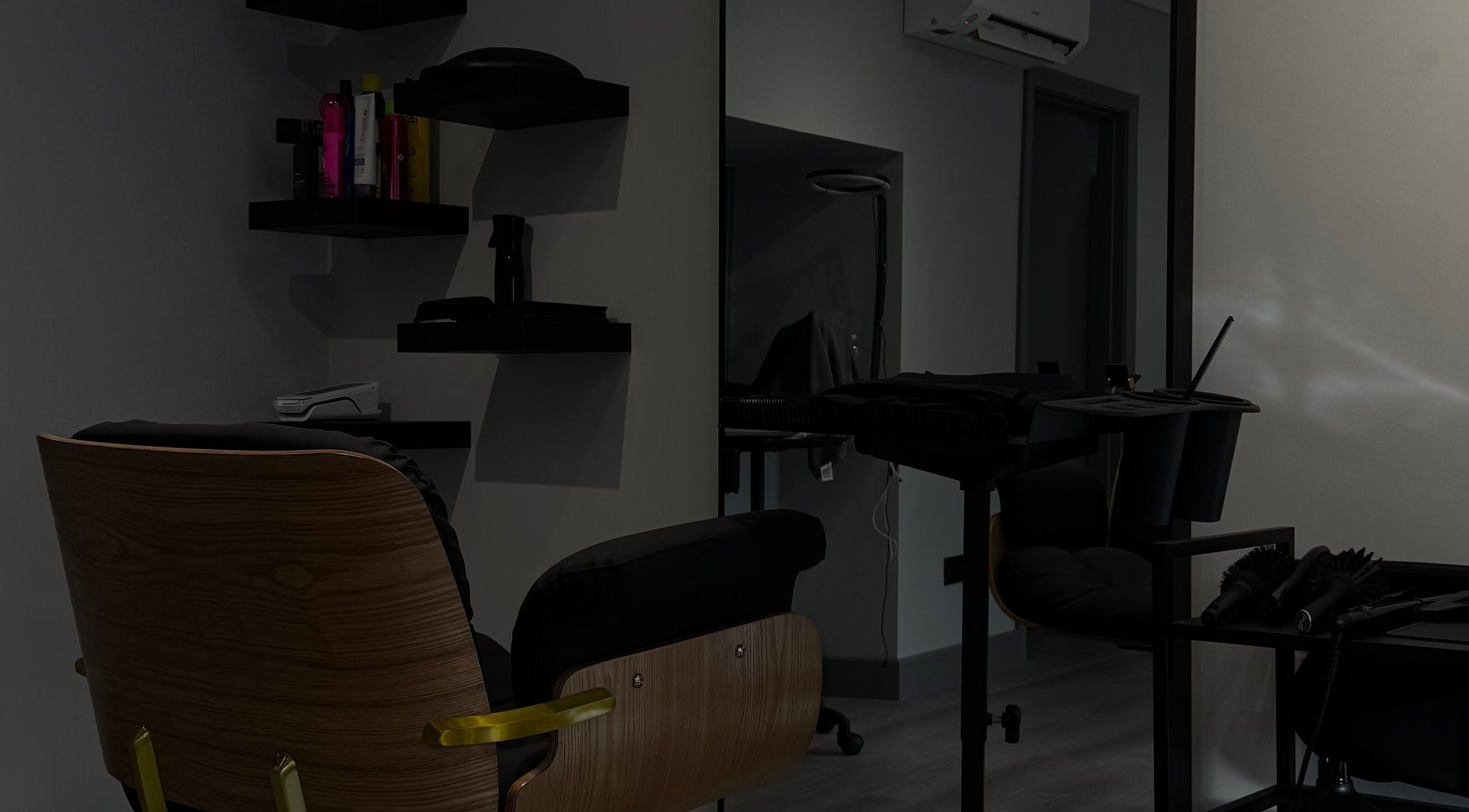 Modern hair salon setup at HAIR Extensions & Treatments, Ennis, County Clare, IE, featuring sleek chair and tools.