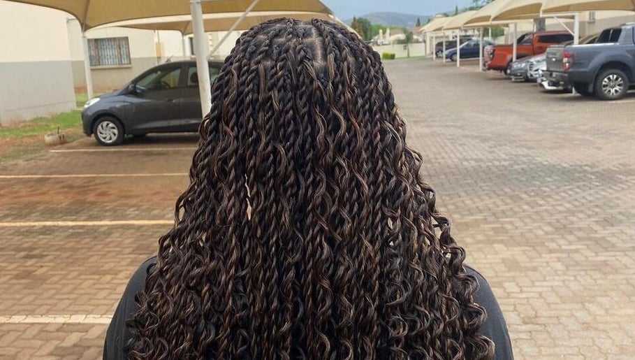 Back view of intricately braided hair at Aura's Aesthetics, Pretoria, Gauteng, ZA.
