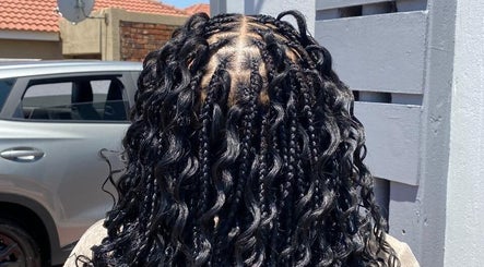 Luxurious braided hairstyle at Aura's Aesthetics, Pretoria, Gauteng, ZA, showcasing intricate detail and style.