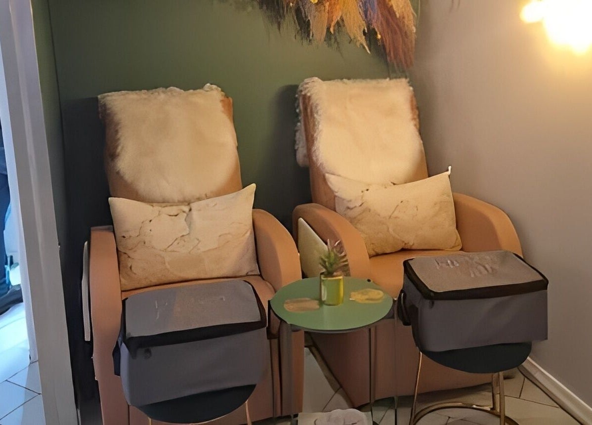 Relaxing lounge chairs at Glow Studio in Roodepoort, Gauteng, ZA, with plush cushions and soft lighting.