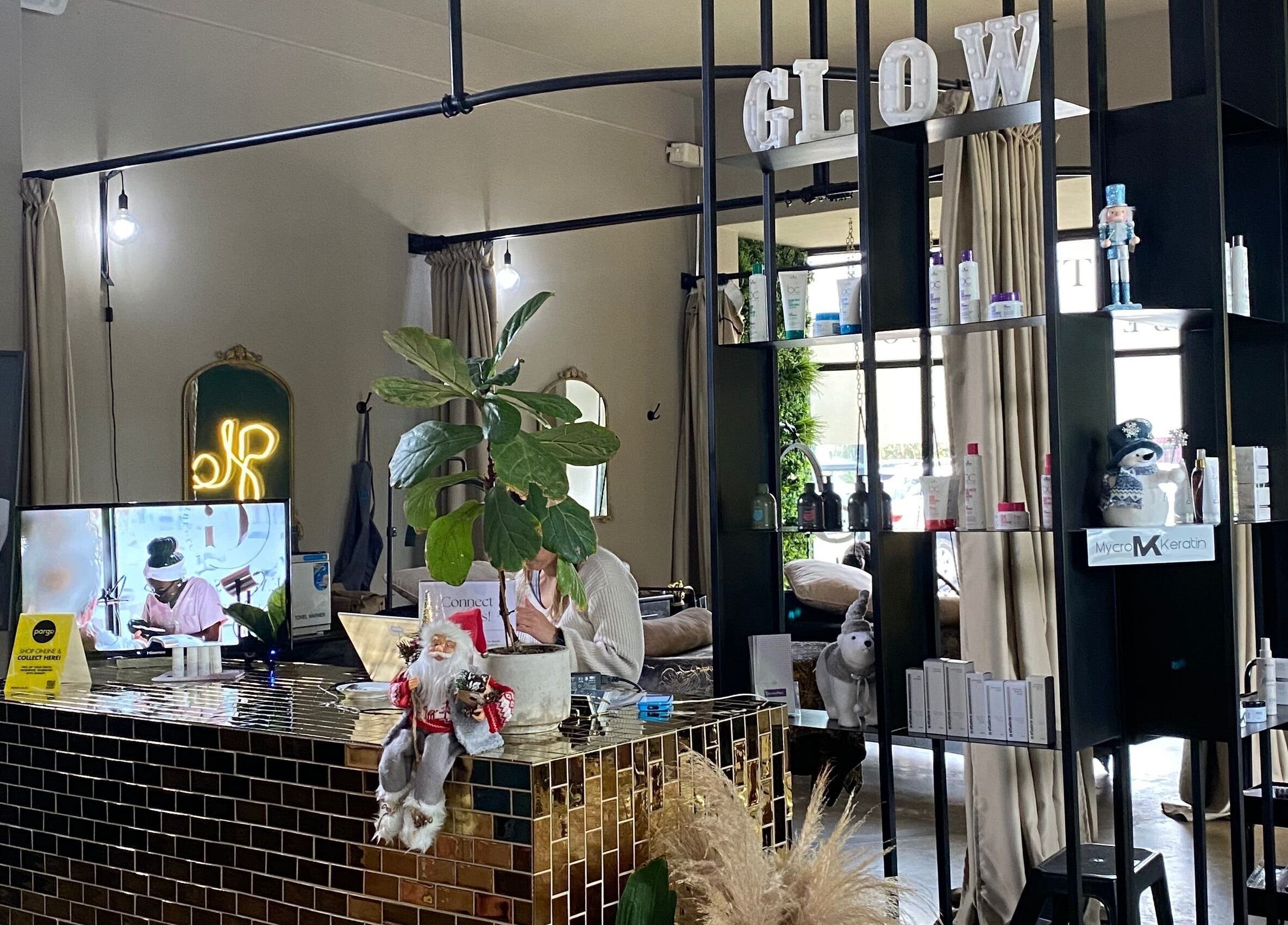 Interior of 'Roxy At Glow' salon in Pretoria, Gauteng, ZA featuring sleek decor and beauty products on display.