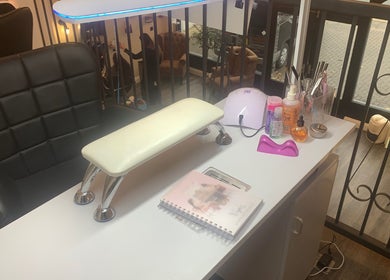 Stylish nail station at Nails By Vya in Douglas, Onchan, IM, showcasing a modern setup and nail products.