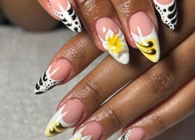 Stylish nail art at Elegant_darlings_na, Windhoek, Khomas Region, NA featuring intricate black, white, and gold designs.
