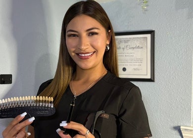 Professional showcasing dental shades at Hockley-Glow Up Aesthetics, Hockley, Texas, US.