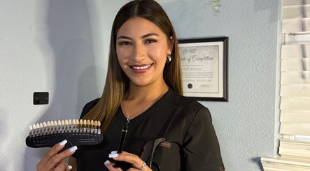 Professional showcasing dental shades at Hockley-Glow Up Aesthetics, Hockley, Texas, US.