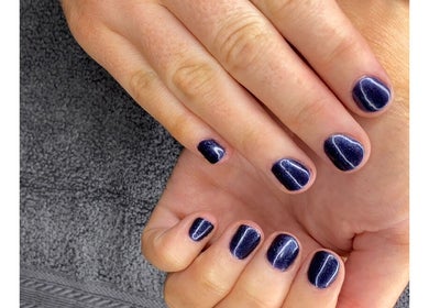 Elegant navy blue manicure at Amaze Beauty, Coleraine, Northern Ireland, GB showcasing nail artistry.