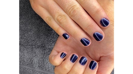 Elegant navy blue manicure at Amaze Beauty, Coleraine, Northern Ireland, GB showcasing nail artistry.