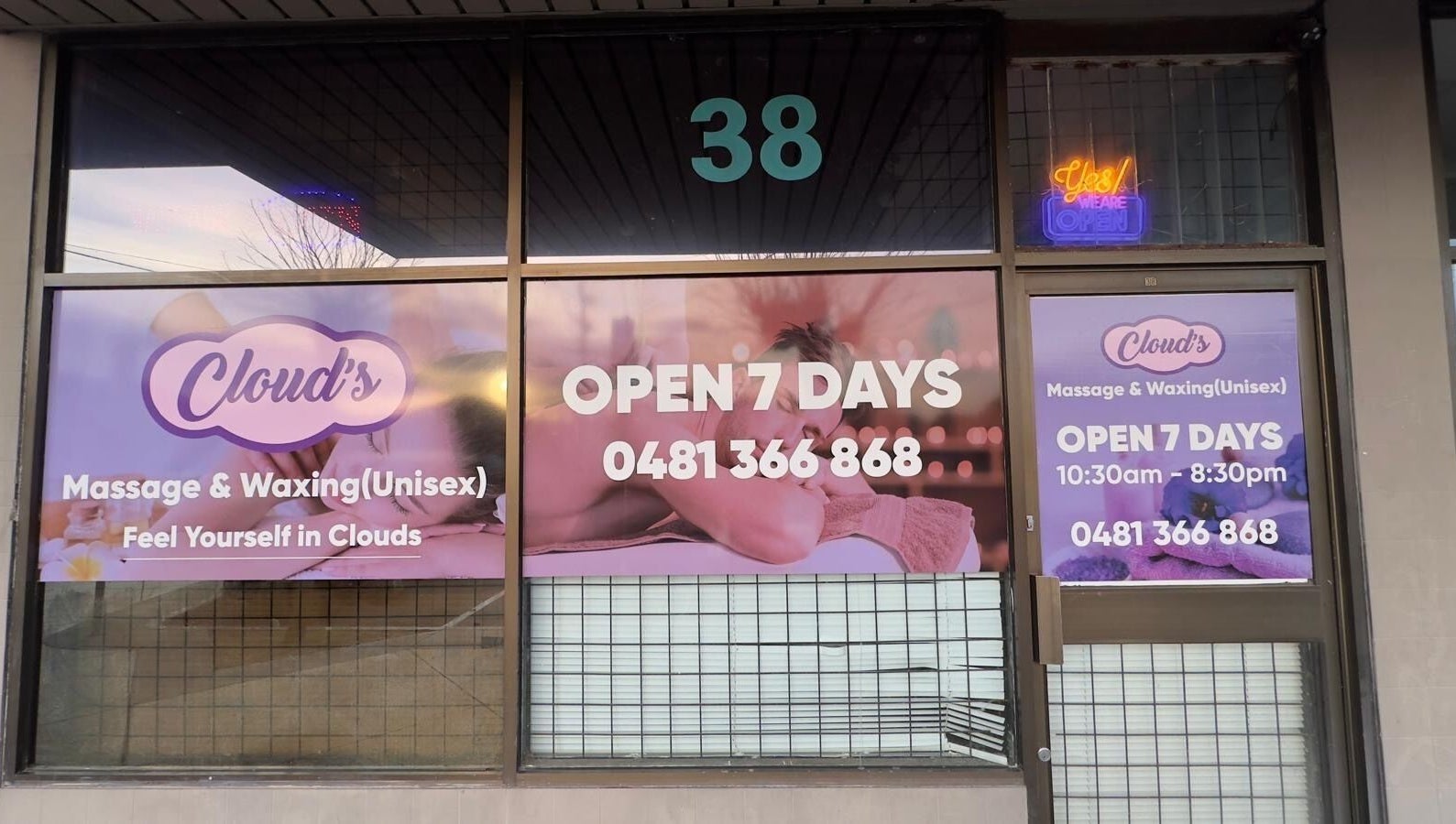 Front view of Clouds Massage and Waxing in Melbourne, Victoria, AU, displaying open hours and contact number.