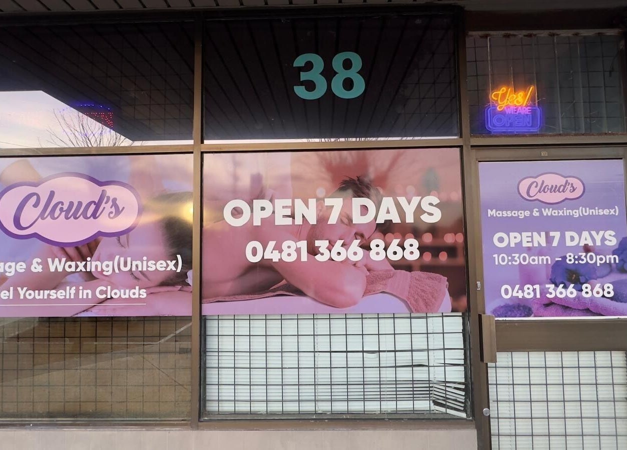 Front view of Clouds Massage and Waxing in Melbourne, Victoria, AU, displaying open hours and contact number.