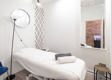 Calming treatment room at The Spa Culture, London, England, GB with soft lighting and serene ambiance.