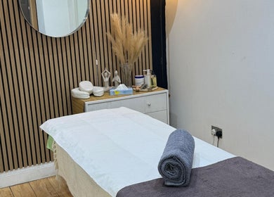 Serene treatment room at The Spa Culture, London, England, GB, featuring a massage table and calming decor.