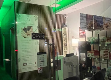 Entrance of The Spa Culture in London, England, GB, showcasing a calming interior with green lighting and wellness products.