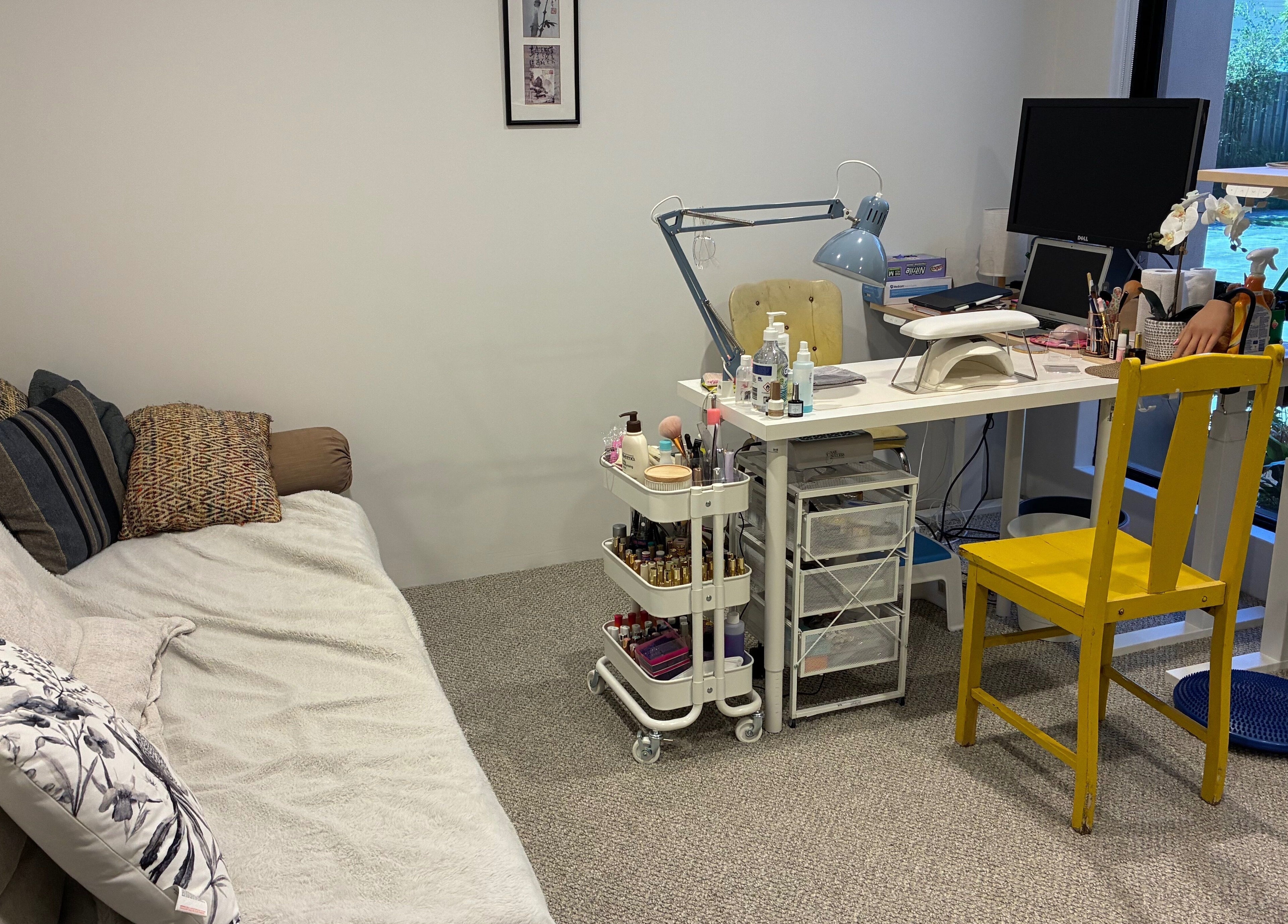 Polished Ember's inviting beauty setup in Willagee, Western Australia, AU with tools and colorful decor.