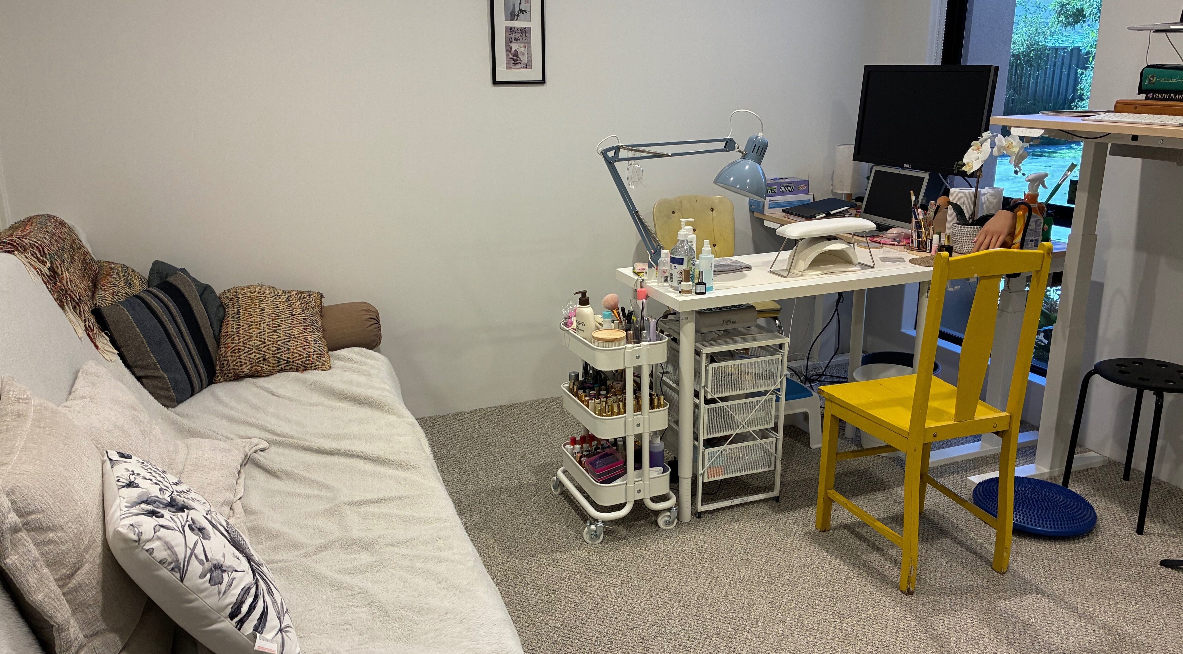 Polished Ember's inviting beauty setup in Willagee, Western Australia, AU with tools and colorful decor.