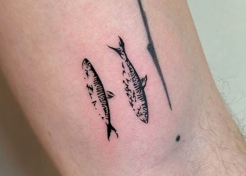 Detailed mackerel tattoo on forearm at TEEMOOINK TATTOO, Surry Hills, New South Wales, AU.