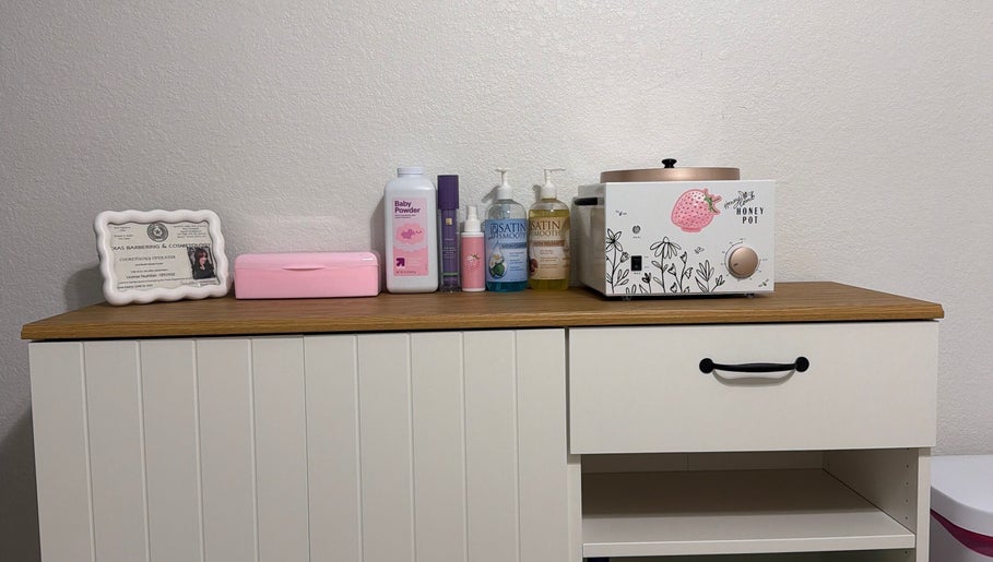 Waxing supplies at Berry Smooth Waxing Co., Dickinson, Texas, US, including lotions and a wax warmer.