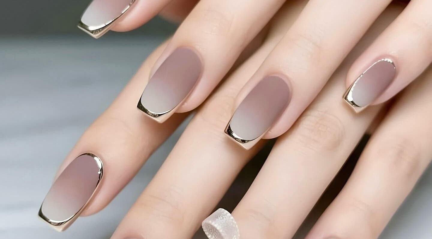 Elegant gradient gel nails with shimmer tips at Gel Nails, Orillia, Ontario, CA.