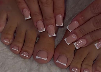 Elegant French manicure and pedicure at Gel Nails, Orillia, Ontario, CA showcasing glossy nail art.