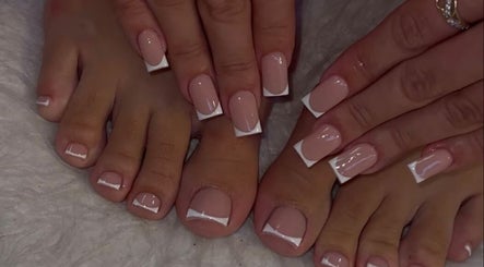 Elegant French manicure and pedicure at Gel Nails, Orillia, Ontario, CA showcasing glossy nail art.