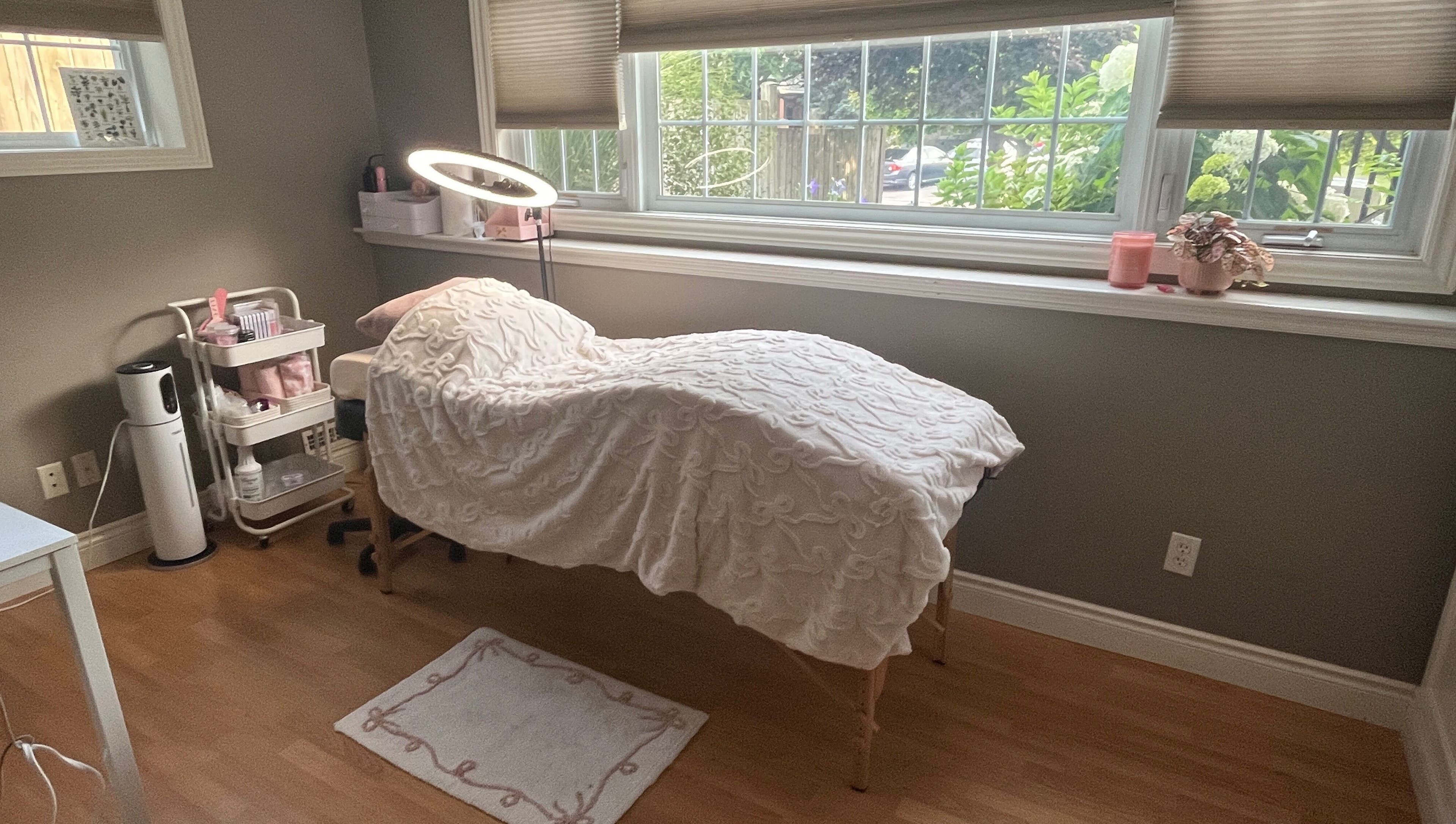 Tranquil lash room at Lovely Lash by Aria, Ayr, Ontario, CA, featuring a plush treatment bed and modern decor.