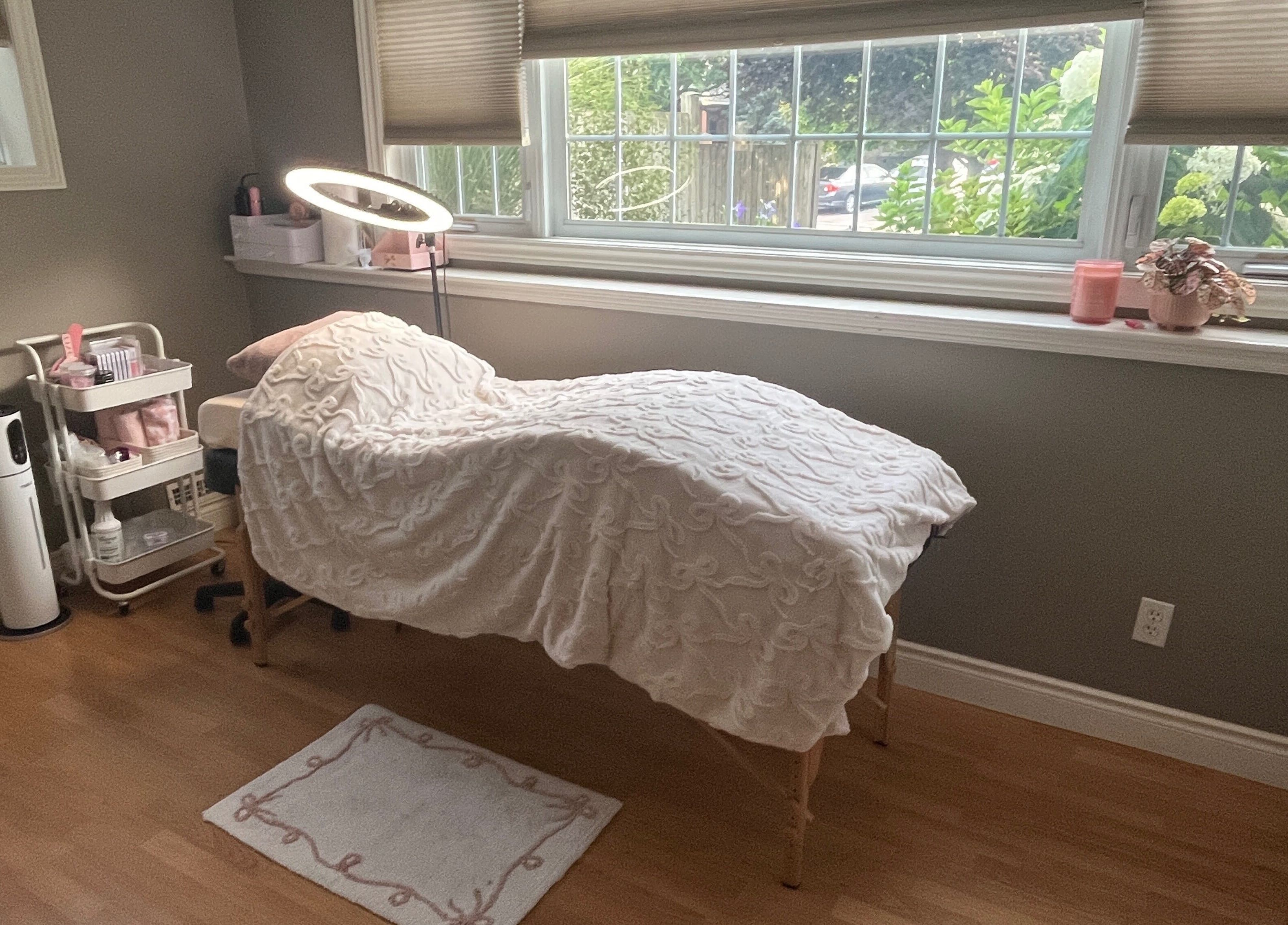 Tranquil lash room at Lovely Lash by Aria, Ayr, Ontario, CA, featuring a plush treatment bed and modern decor.