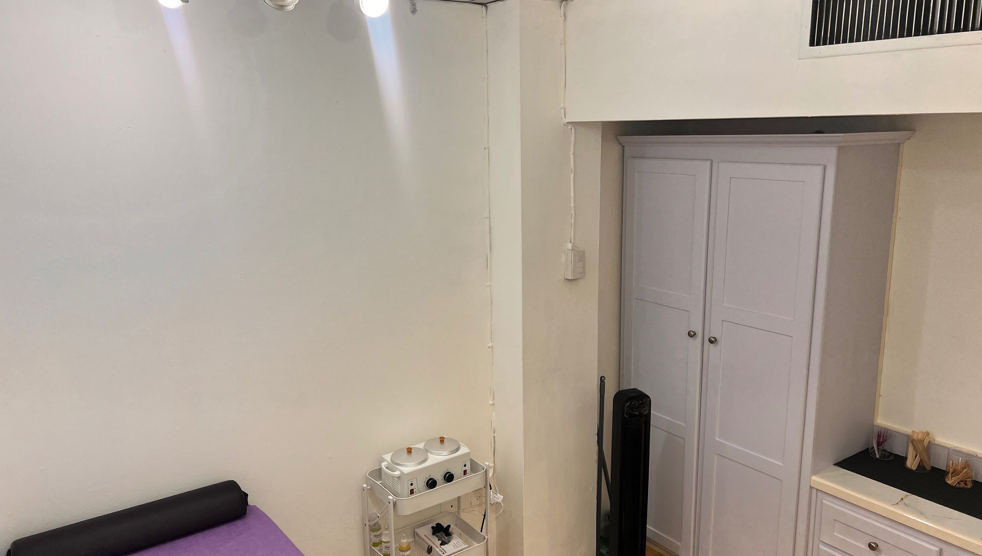 ACEluxeluminance treatment room with purple bed and modern decor in Port Of Spain, Port of Spain, TT.