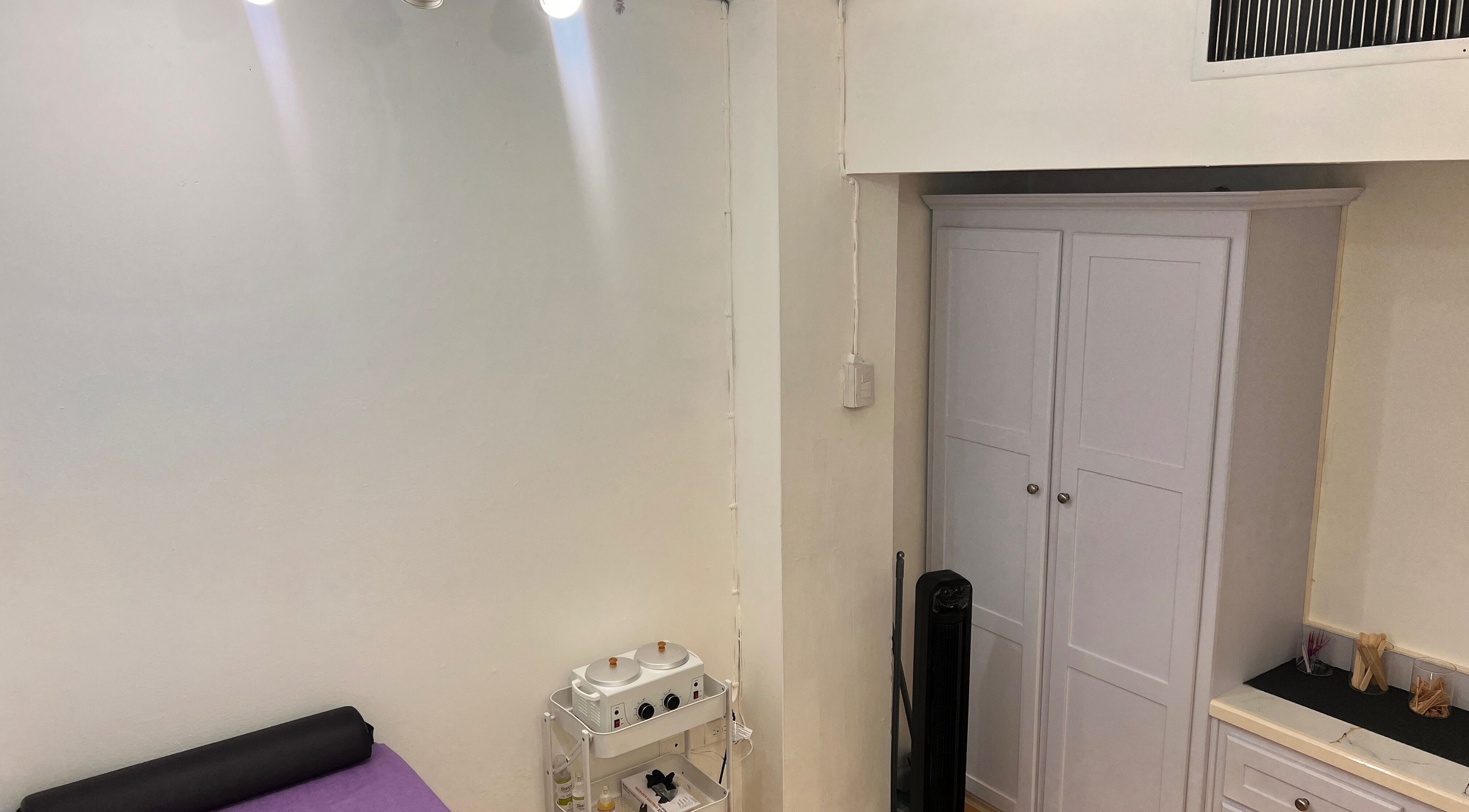 ACEluxeluminance treatment room with purple bed and modern decor in Port Of Spain, Port of Spain, TT.