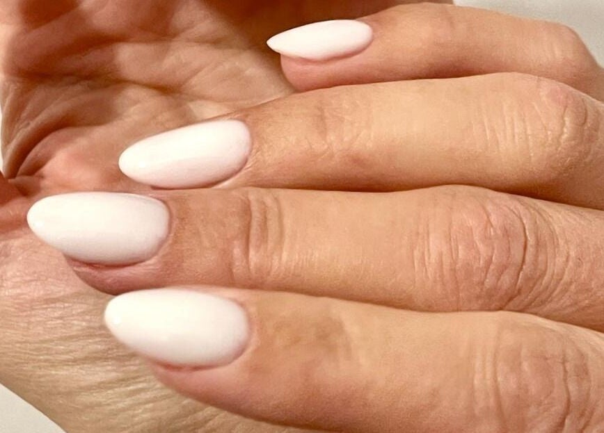 Beautiful white manicured nails at Nail Room, Bromley, England, GB, showcasing elegance and style.
