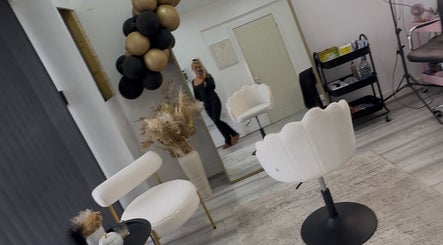 Modern salon interior at Beauty&lengths by aim, Stoke-on-Trent, England, GB with elegant chairs and decor.