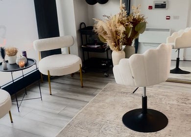 Elegant salon interior at Beauty&lengths by aim, Stoke-on-Trent, England, featuring upscale seating and decor.