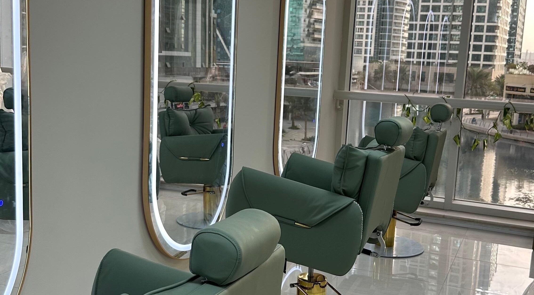 Elegant salon chairs with city view at Jazz Loc Studio, Dubai, Dubai, AE. A serene beauty experience.