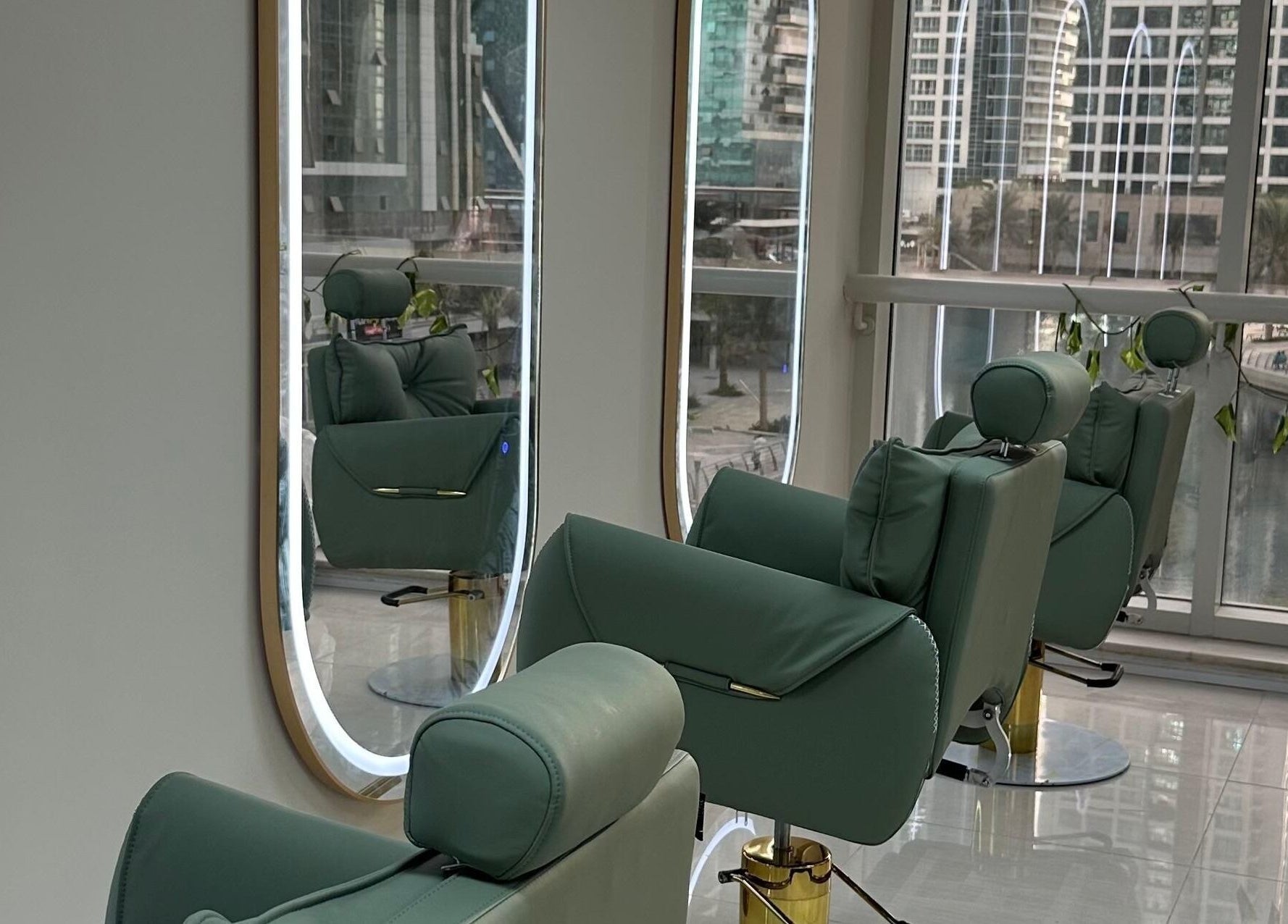 Inside Jazz Loc Studio at 2nd Floor - #210, Dubai, AE, featuring plush green chairs and sleek mirrors.