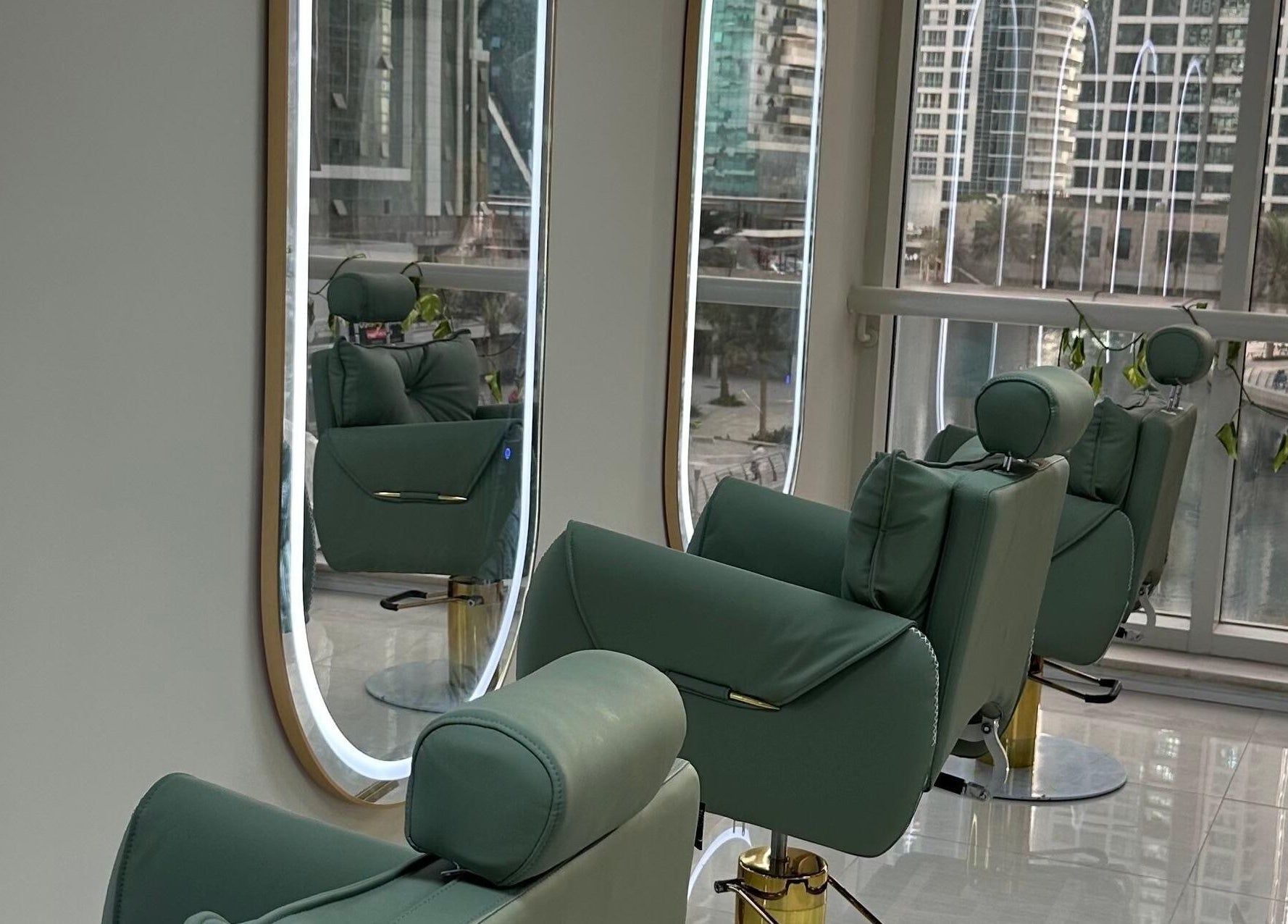 Modern salon with chic green chairs at Jazz Loc Studio, 2nd Floor - #210, Dubai, AE, overlooking city views.