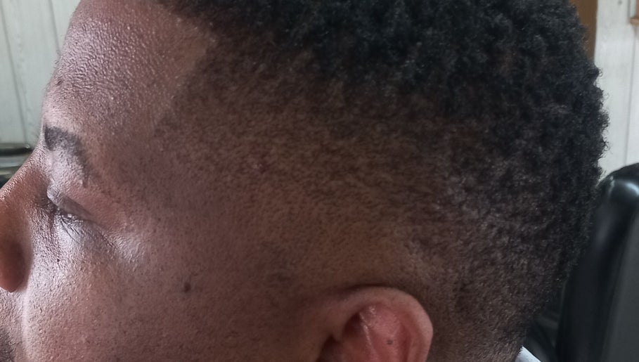 Close-up of a classic fade haircut at Classic Touch Barber, Sandton, Gauteng, ZA.