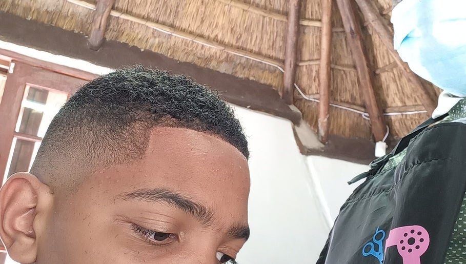 Close-up of precise haircut at Classic Touch Barber, Sandton, Gauteng, ZA, showcasing a sharp fade.