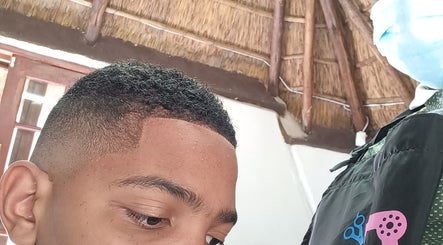 Close-up of precise haircut at Classic Touch Barber, Sandton, Gauteng, ZA, showcasing a sharp fade.
