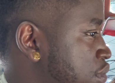 Profile view of a customer at Classic Touch Barber in Sandton Gauteng ZA showcasing a fresh haircut.