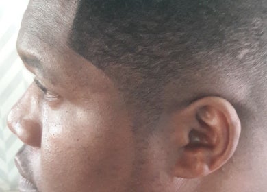 Close-up of precise fade haircut at Classic Touch Barber, Sandton, Gauteng, ZA.
