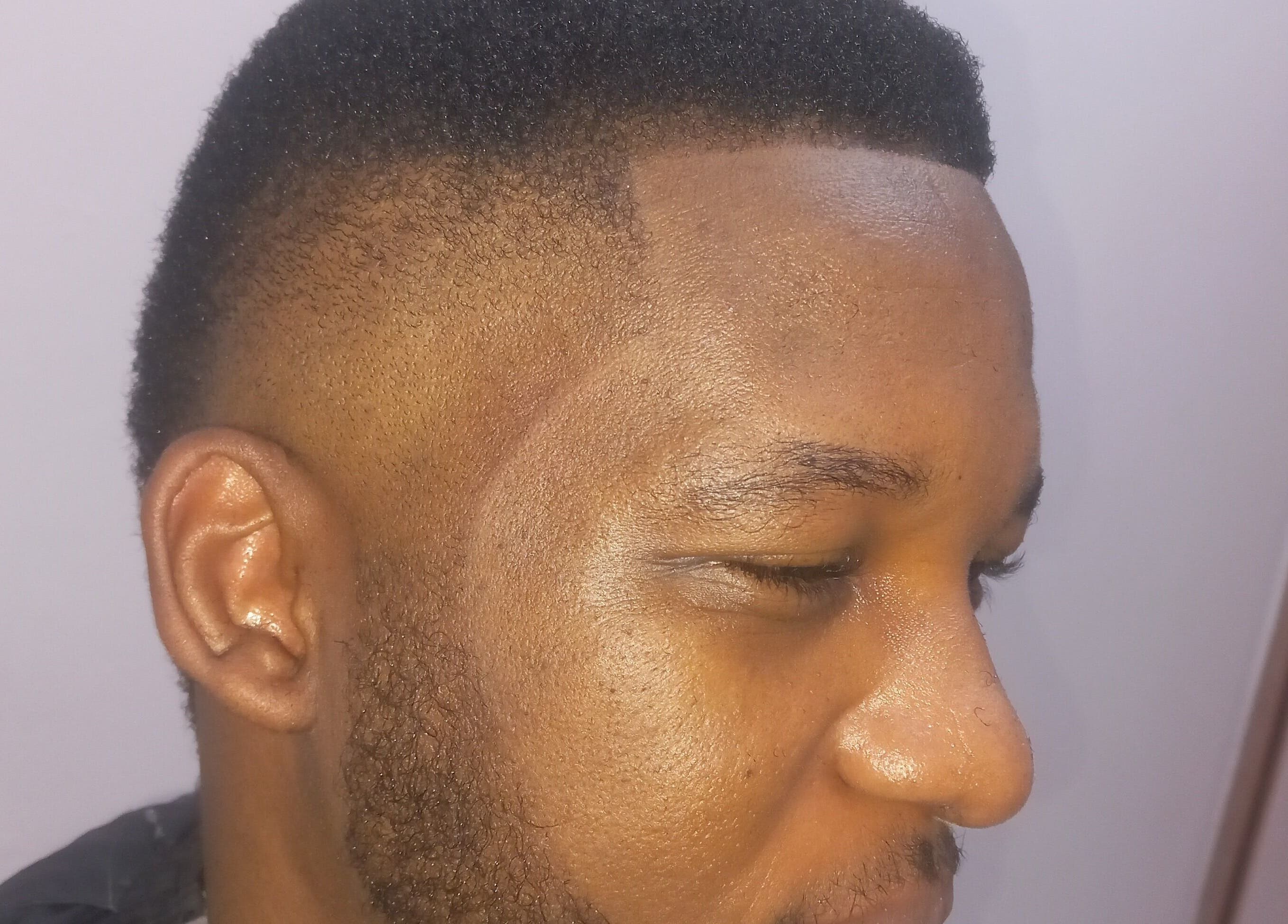 Man with a sleek fade haircut at Classic Touch Barber in Sandton, Gauteng, ZA.