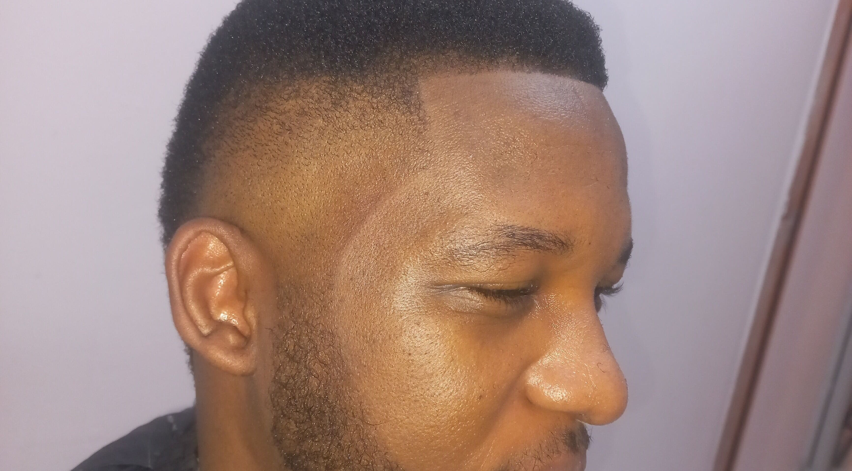 Man with a sleek fade haircut at Classic Touch Barber in Sandton, Gauteng, ZA.