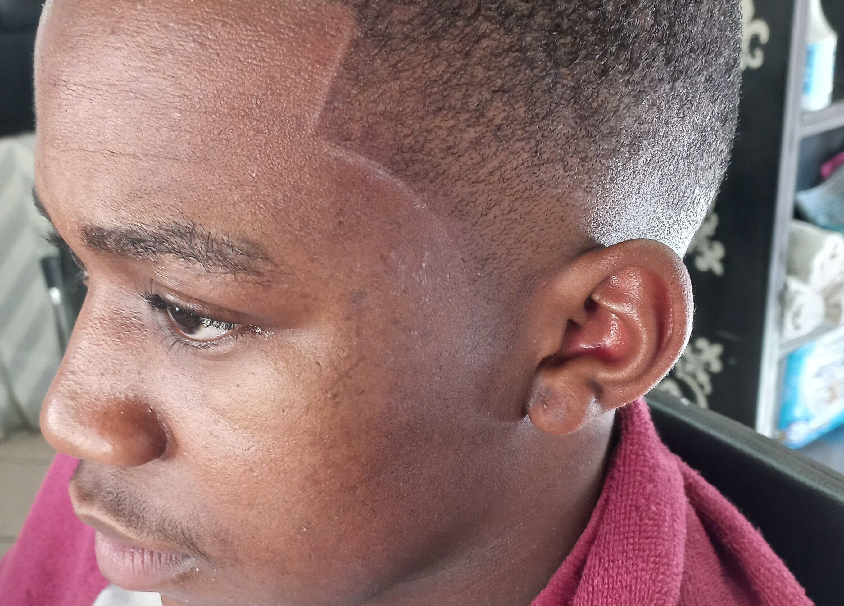 Precision haircut at Classic Touch Barber, Sandton, Gauteng, ZA showcasing a fresh fade style.