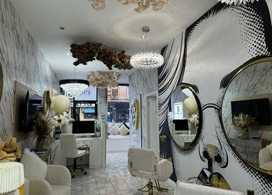 Chic interior of HairByD salon, Glasgow, Scotland, GB, featuring elegant decor and modern styling stations.